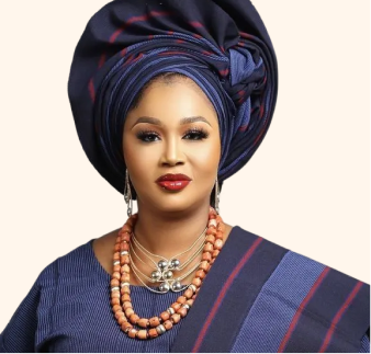 Female model wearing dark blue gele